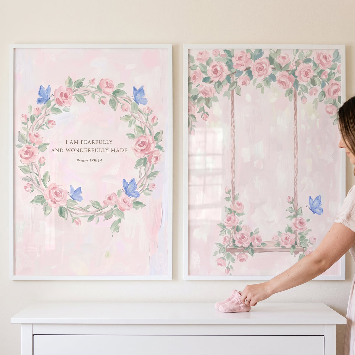 Watercolor pink butterfly rose wall art set of 2 featuring a floral wreath with a Bible verse and a rose-covered swing.