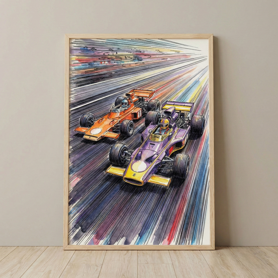 A framed vertical illustration depicts two vintage open-wheel racing cars side-by-side at high speed. One car is a vibrant purple with yellow accents, while the other is bright orange. Both feature drivers in helmets. The composition is filled with dynamic, multi-colored streaks that create a powerful sense of motion. The artwork is characterized by bold ink outlines and expressive washes of color. It is shown in a light wood frame, leaning against a neutral wall on a wooden floor.