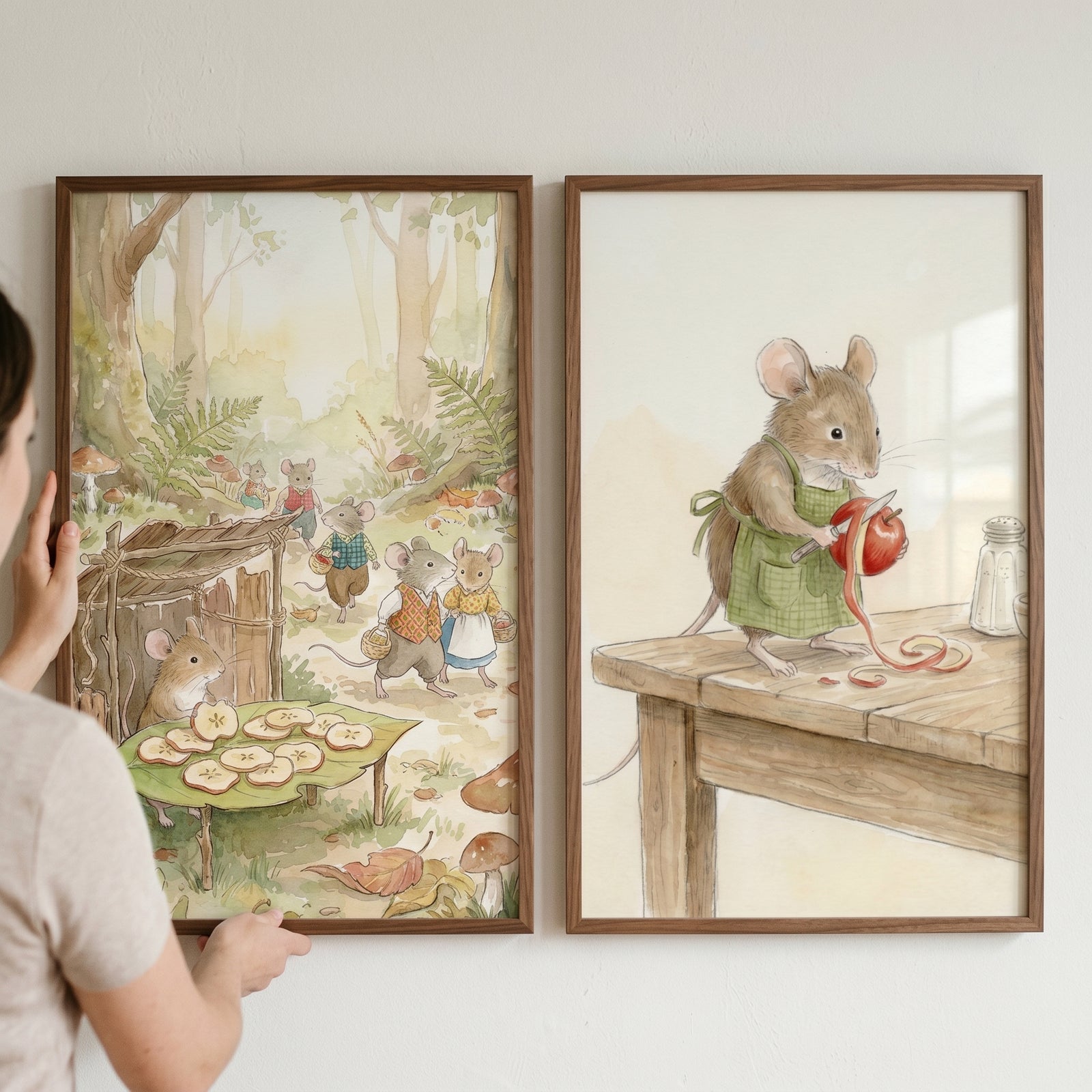 Watercolor rustic woodland mouse wall art set of 2 featuring mice in a forest and a mouse peeling an apple.