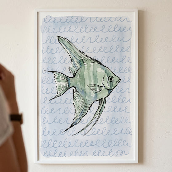 Watercolor sage green angelfish wall art in a white frame, set against a light blue background with swirly line patterns.