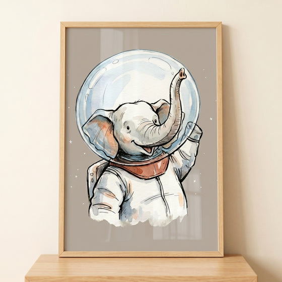 Watercolor style illustration of a smiling elephant wearing a white astronaut suit and oversized space helmet, with its trunk raised playfully inside a light wood frame against a neutral background.