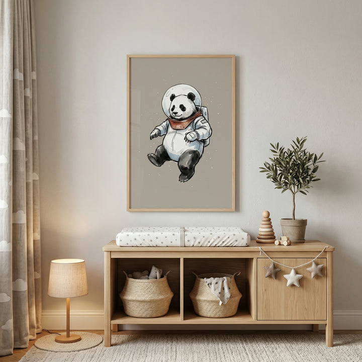 Watercolor space suit panda wall art above a wooden changing table with baskets, a lamp, and star ornaments in a nursery.