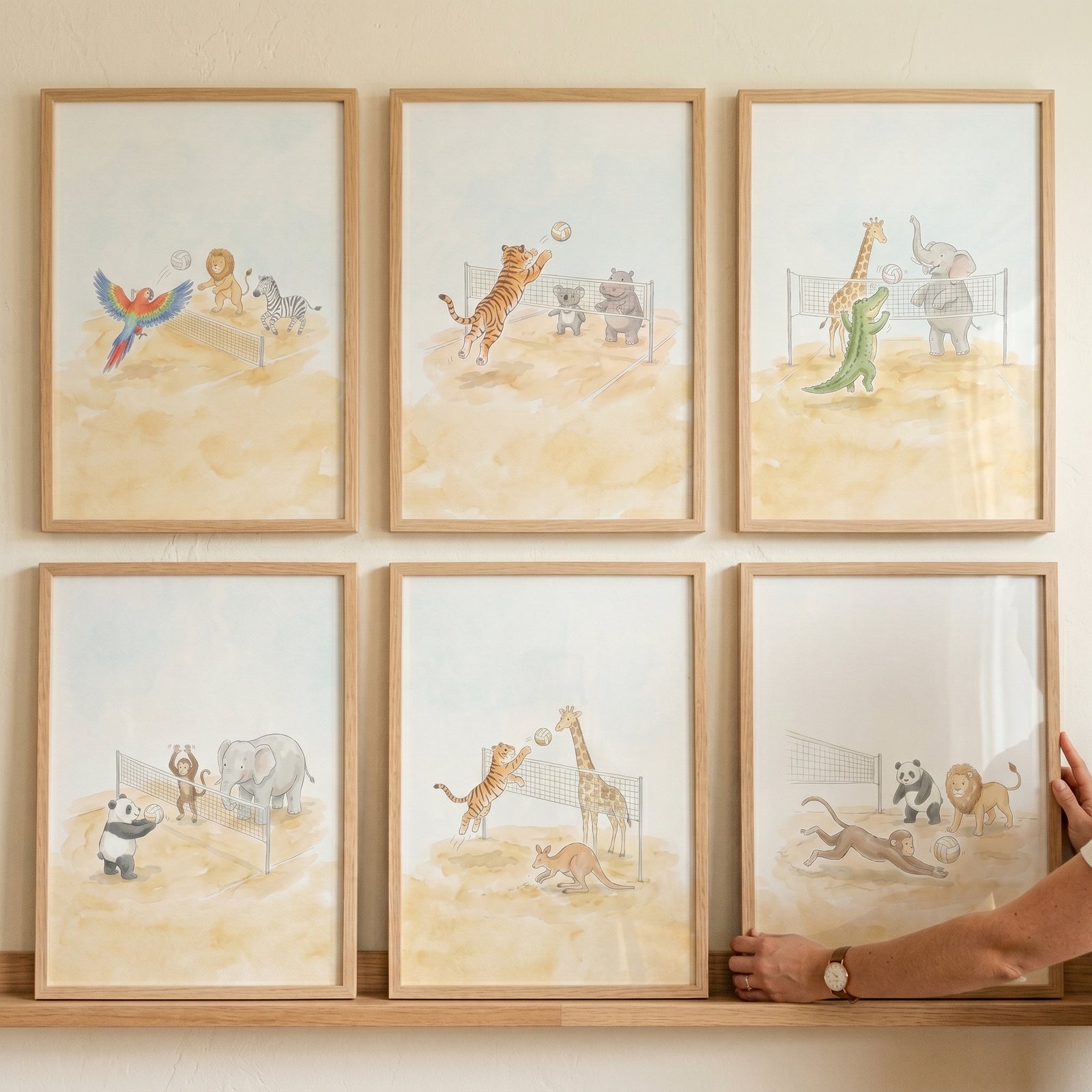 Watercolor volleyball safari animals wall art set of 6 with tigers, giraffes, and elephants playing on a sandy court.