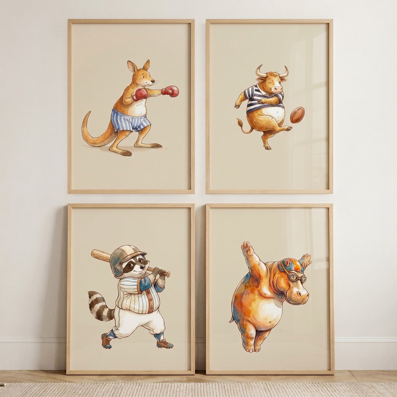Watercolor whimsical sports animals wall art set of 4: boxing kangaroo, football bull, baseball raccoon, and diving hippo.