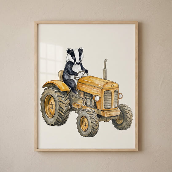 Watercolor yellow tractor badger wall art features a badger driving a vintage tractor in a wooden frame.
