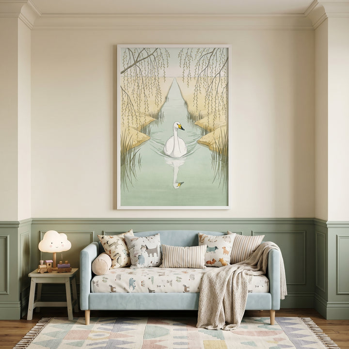 Weeping willow white swan wall art hangs above a blue sofa with patterned pillows in a room with green paneled walls.
