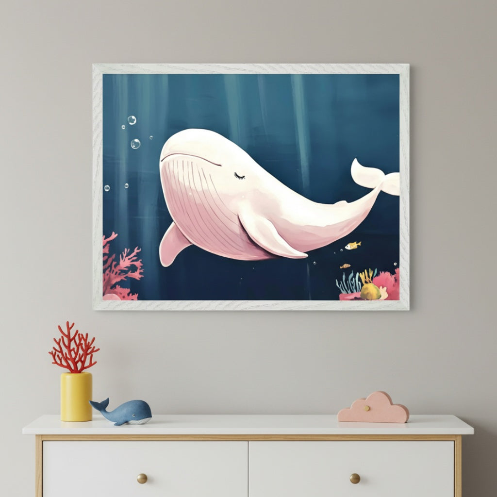 Modern kid's room with a white dresser. A white framed print of a light pink cartoon whale swimming in a dark blue underwater scene with coral and fish hangs centered above the dresser.