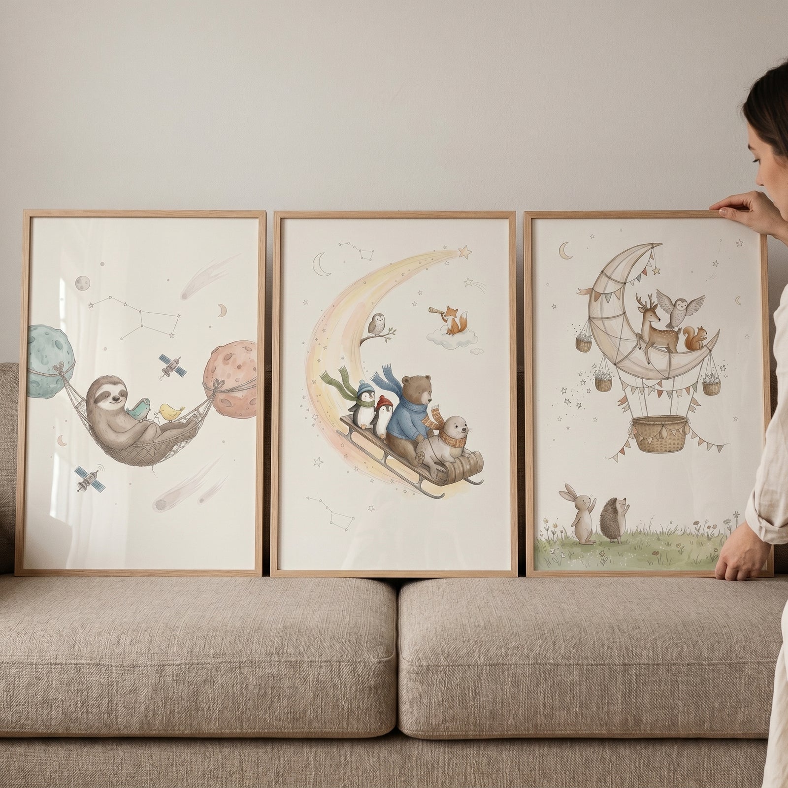 Whimsical celestial forest animals wall art set of 3 with a sloth in space, animals on a moon sled, and a moon balloon.