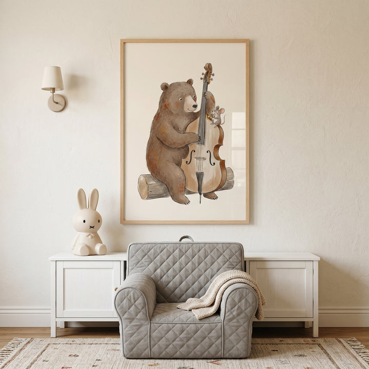 Whimsical cello playing bear wall art hangs above a grey armchair and bunny lamp in a neutral-toned child's room.