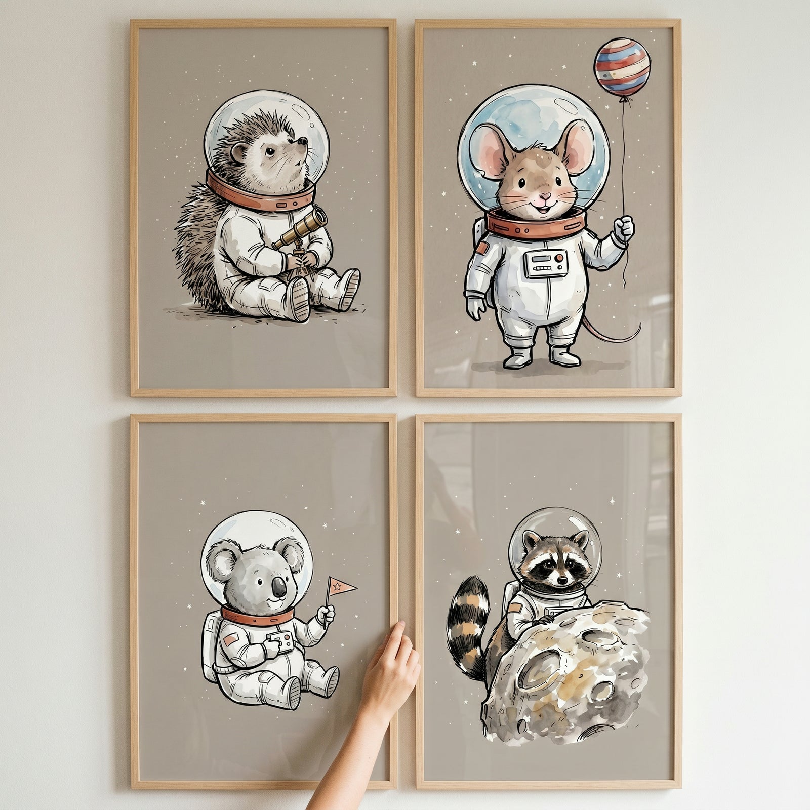 Whimsical cosmic explorer animal wall art set of 4 featuring a hedgehog, mouse, koala, and raccoon in space suits.