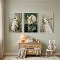 Whimsical daisy crown bunny wall art set of 3 above a dresser and bunny ear chair in a sage green nursery with a rug.