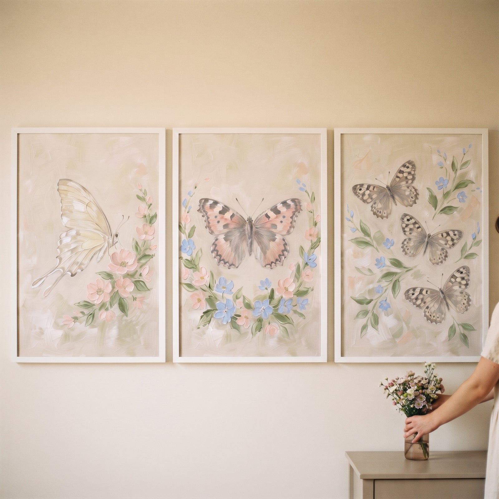 Whimsical garden pastel butterfly wall art set of 3 featuring soft floral accents and butterflies in white frames.