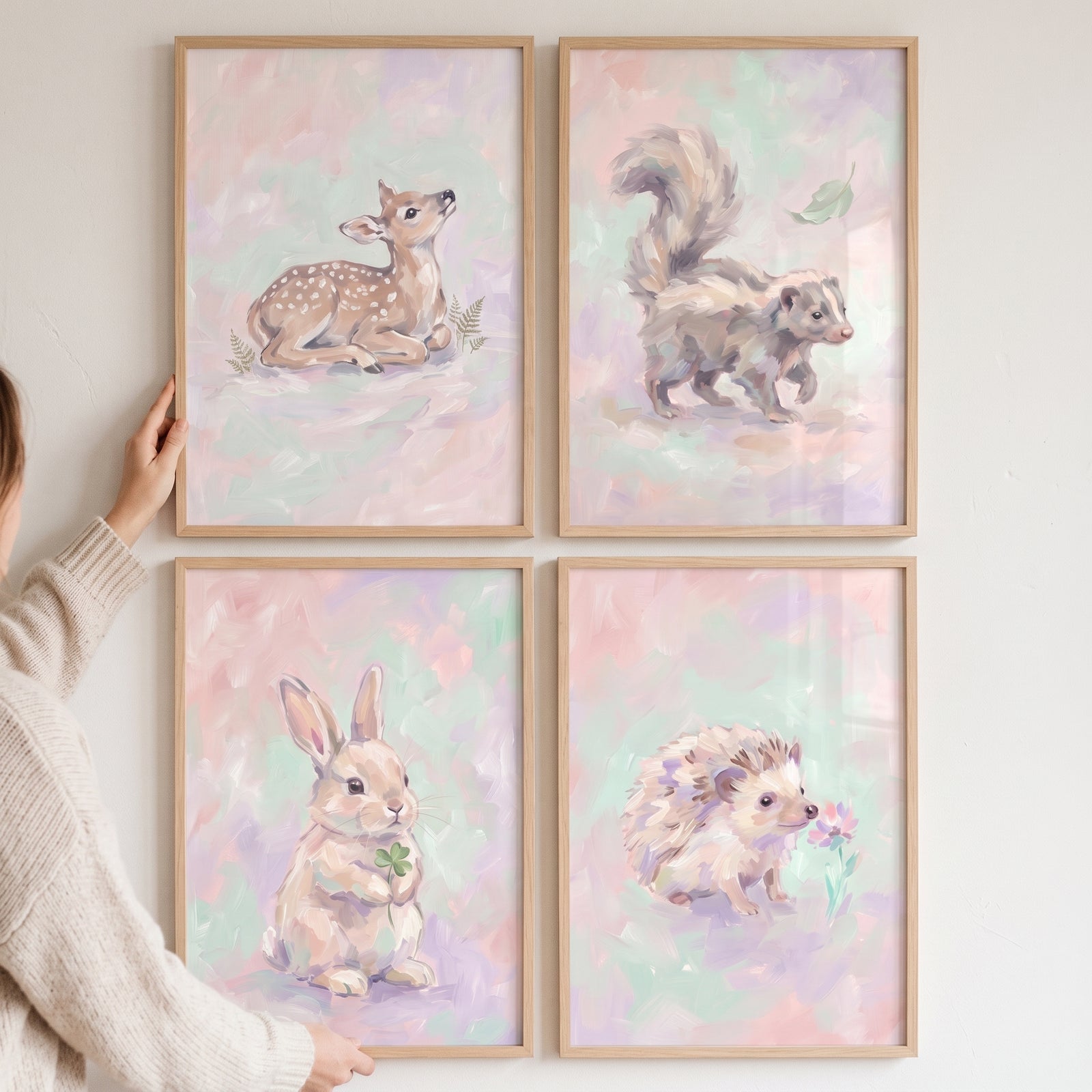 Whimsical lilac baby animal wall art set of 4 featuring a deer, skunk, rabbit, and hedgehog in wood frames.