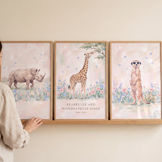Whimsical meadow safari animals wall art set of 3 with a rhino, giraffe with Psalm 139:14 text, and a meerkat.