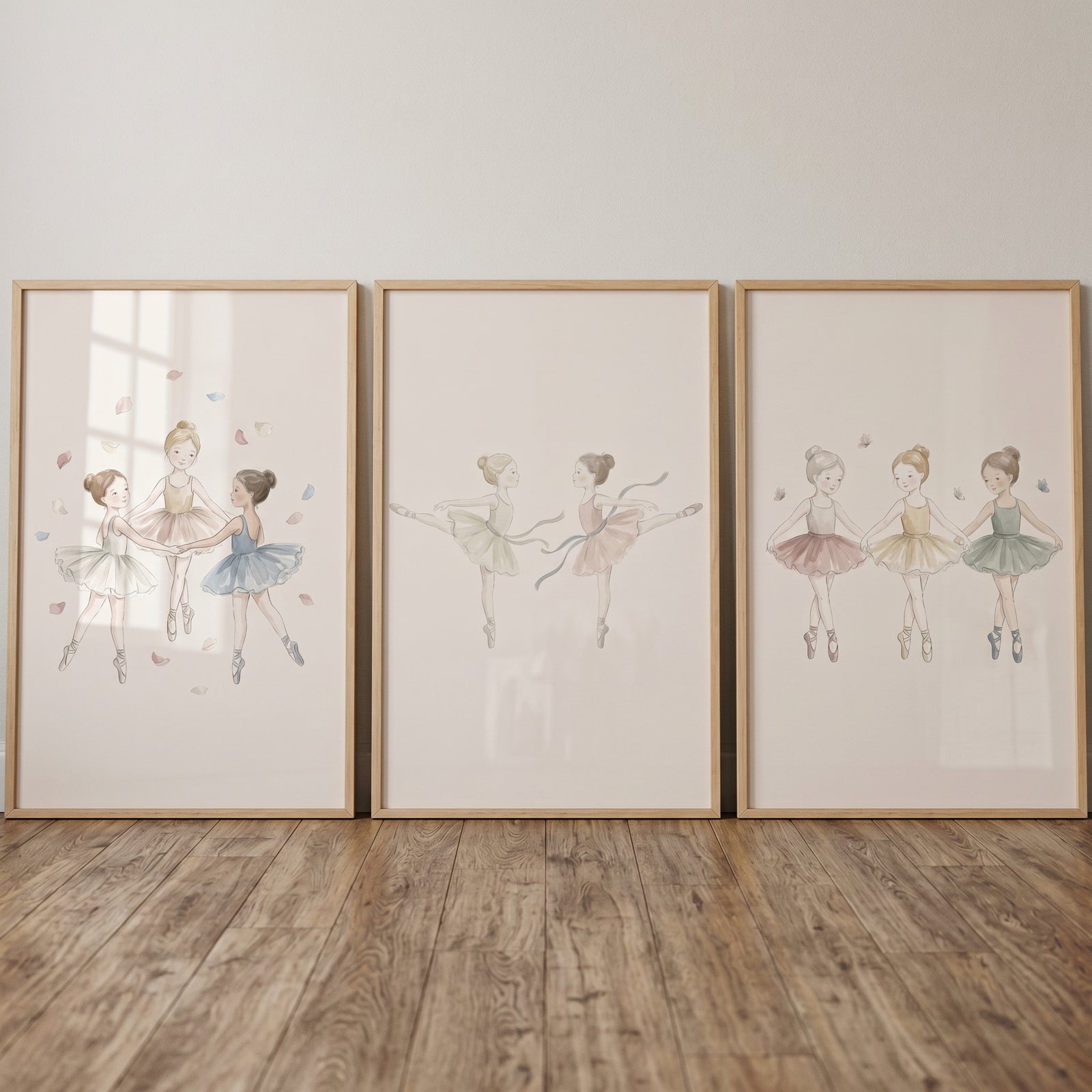 Whimsical muted pastel ballerina wall art set of 3 in wood frames, showing illustrations of young dancers in tutus.