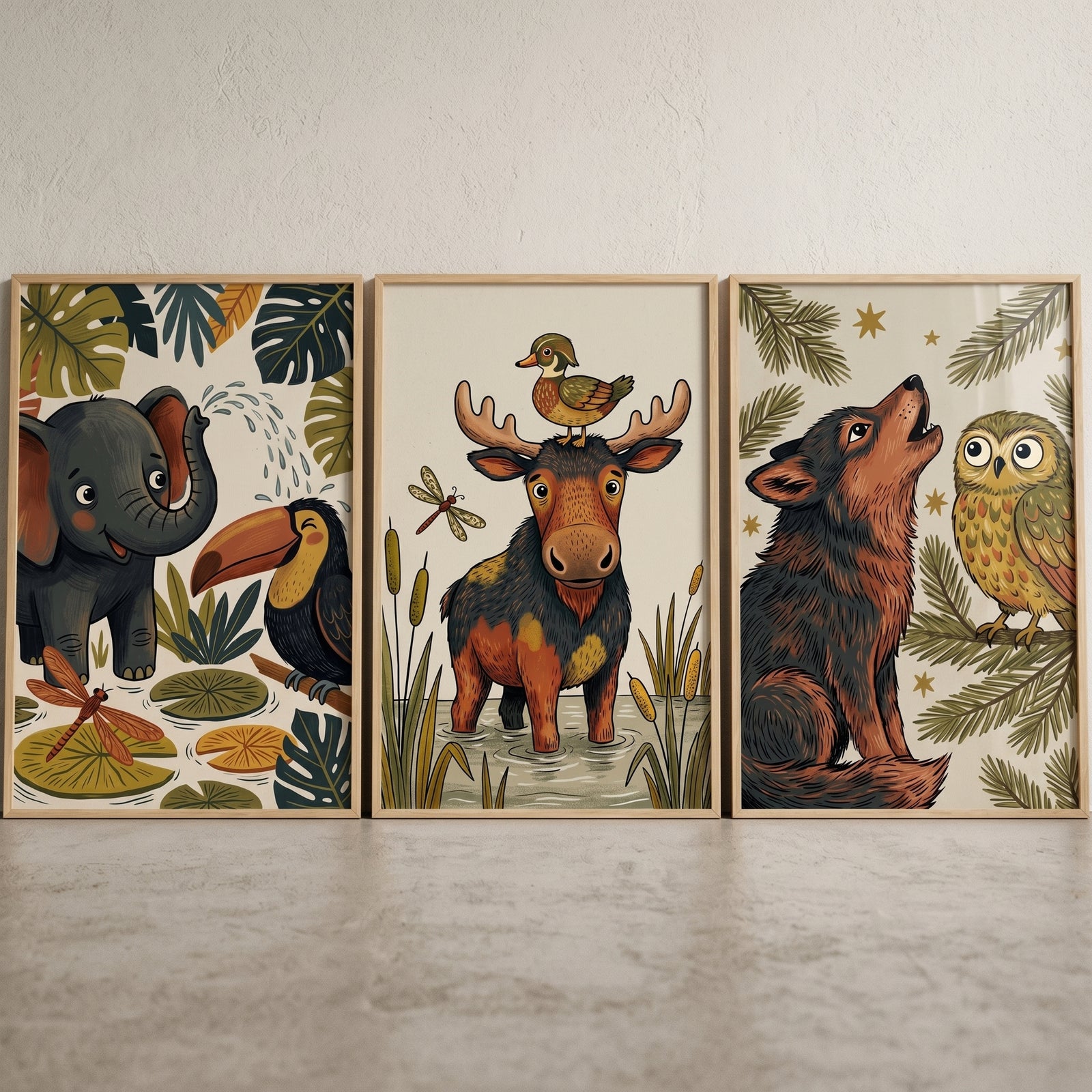 Whimsical nature illustrated animals wall art set of 3 with an elephant, toucan, moose, wolf, and owl in wood frames.