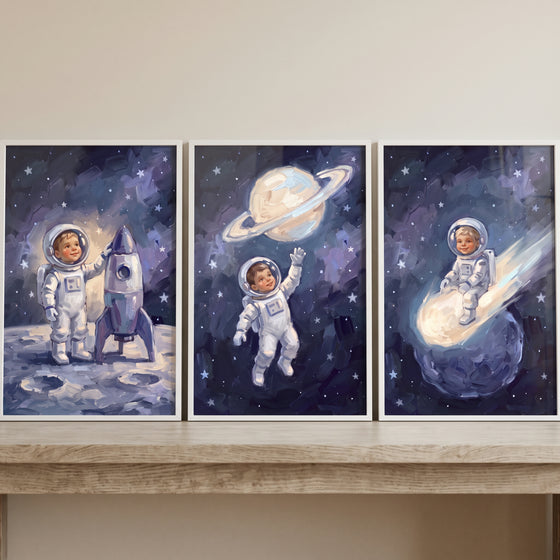 Whimsical navy baby astronaut wall art set of 3 features a child exploring space with a rocket and stars.