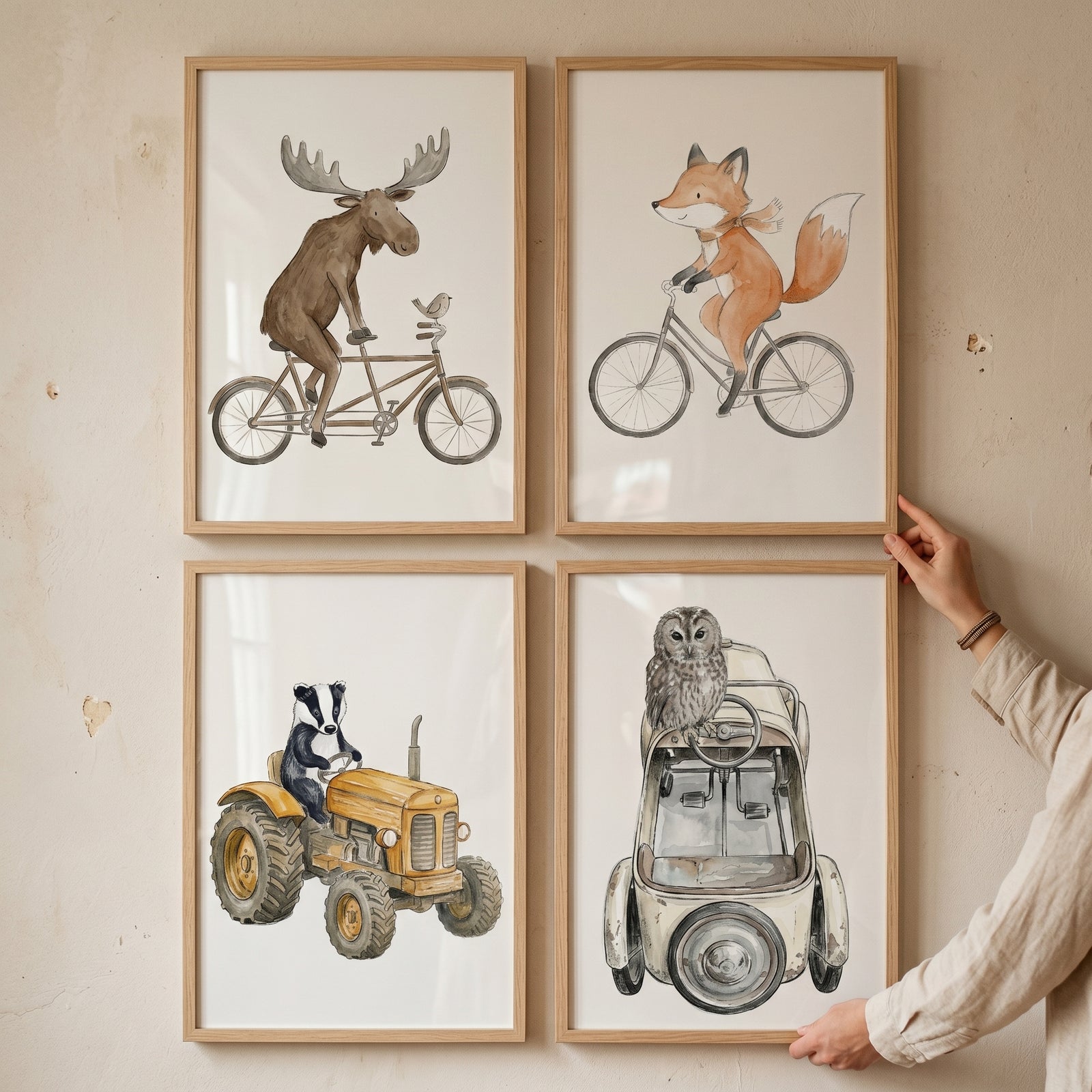 Whimsical neutral traveling animal wall art set of 4 featuring a moose, fox, badger, and owl riding various vehicles.