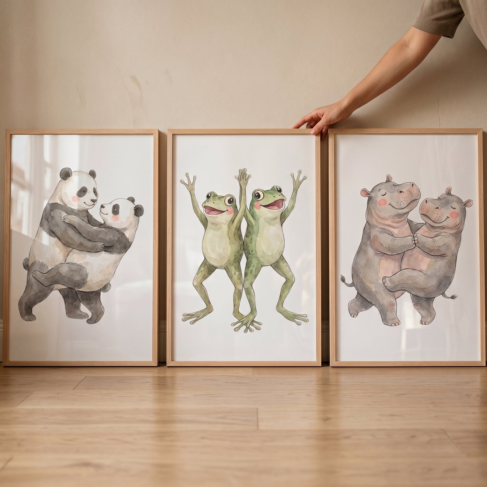 Whimsical nursery dancing animal wall art set of 3 featuring pairs of pandas, frogs, and hippos in wooden frames.