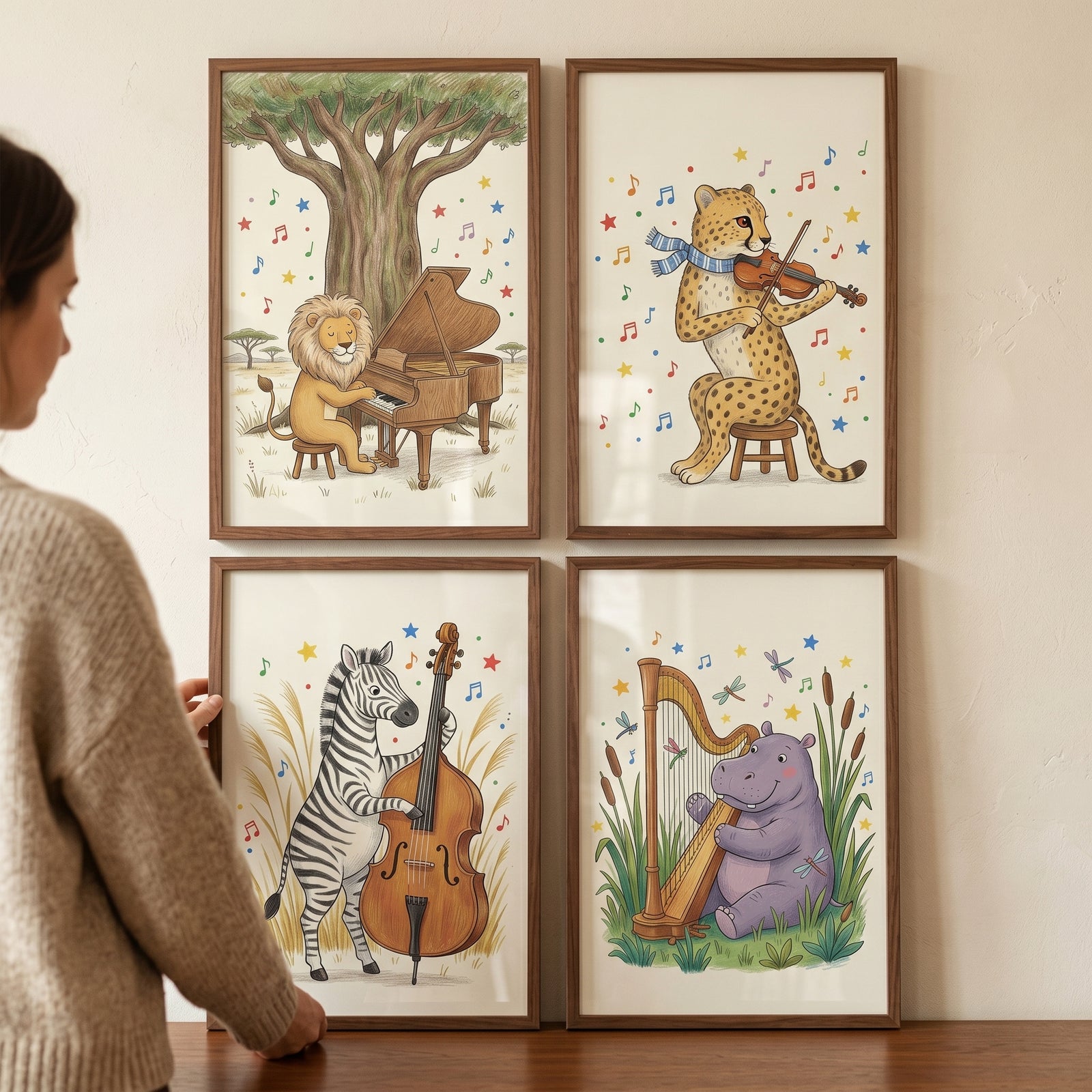 A person hangs a whimsical orchestral savanna animals wall art set of 4 featuring a lion, cheetah, zebra, and hippo.