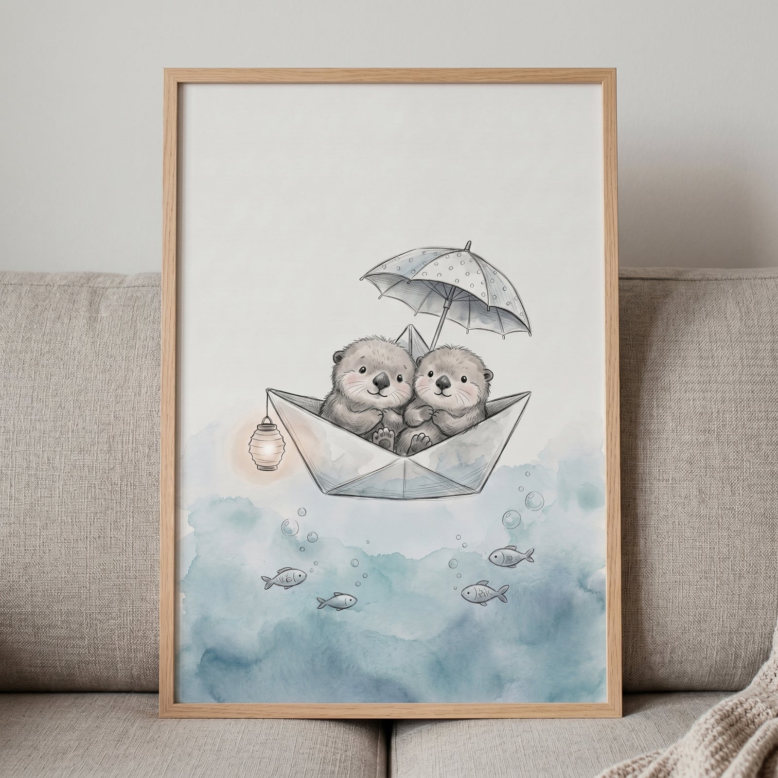 Whimsical paper boat otters wall art features two otters under an umbrella floating on watercolor blue waves with fish.
