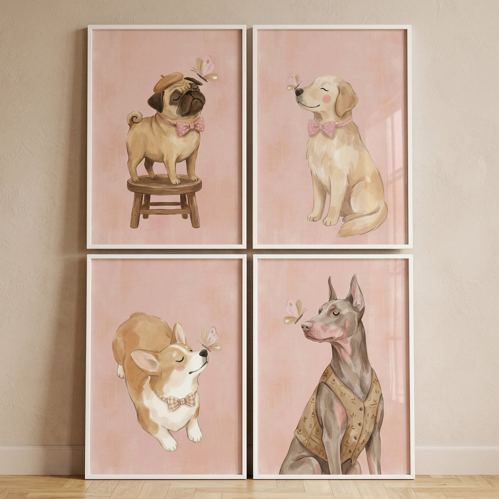 A collection of four framed illustrations is displayed in a two-by-two grid on a neutral-toned wall. Each individual piece features a different breed of dog against a soft, pale pink background, capturing a peaceful moment between the animals and small, delicate butterflies.