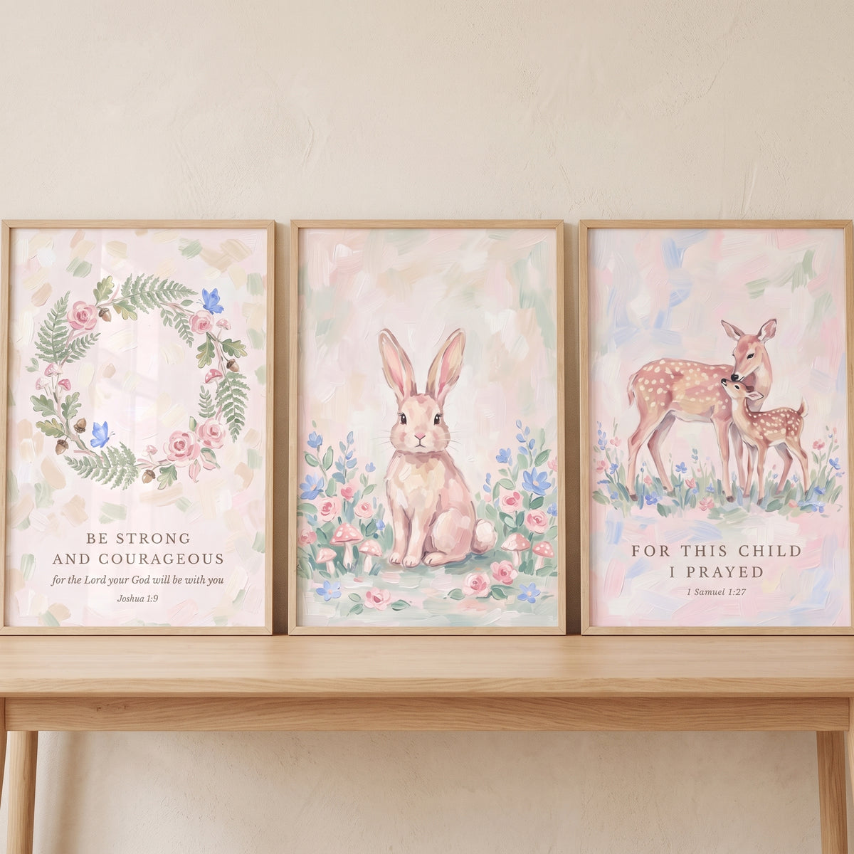 Whimsical pink forest animals wall art set of 3 featuring a bunny, deer, and floral wreath with bible verses.