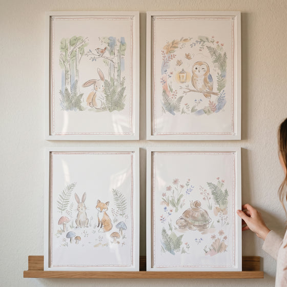 Whimsical sketch woodland animals wall art set of 4 featuring a rabbit, owl, fox, and turtle in a watercolor style.