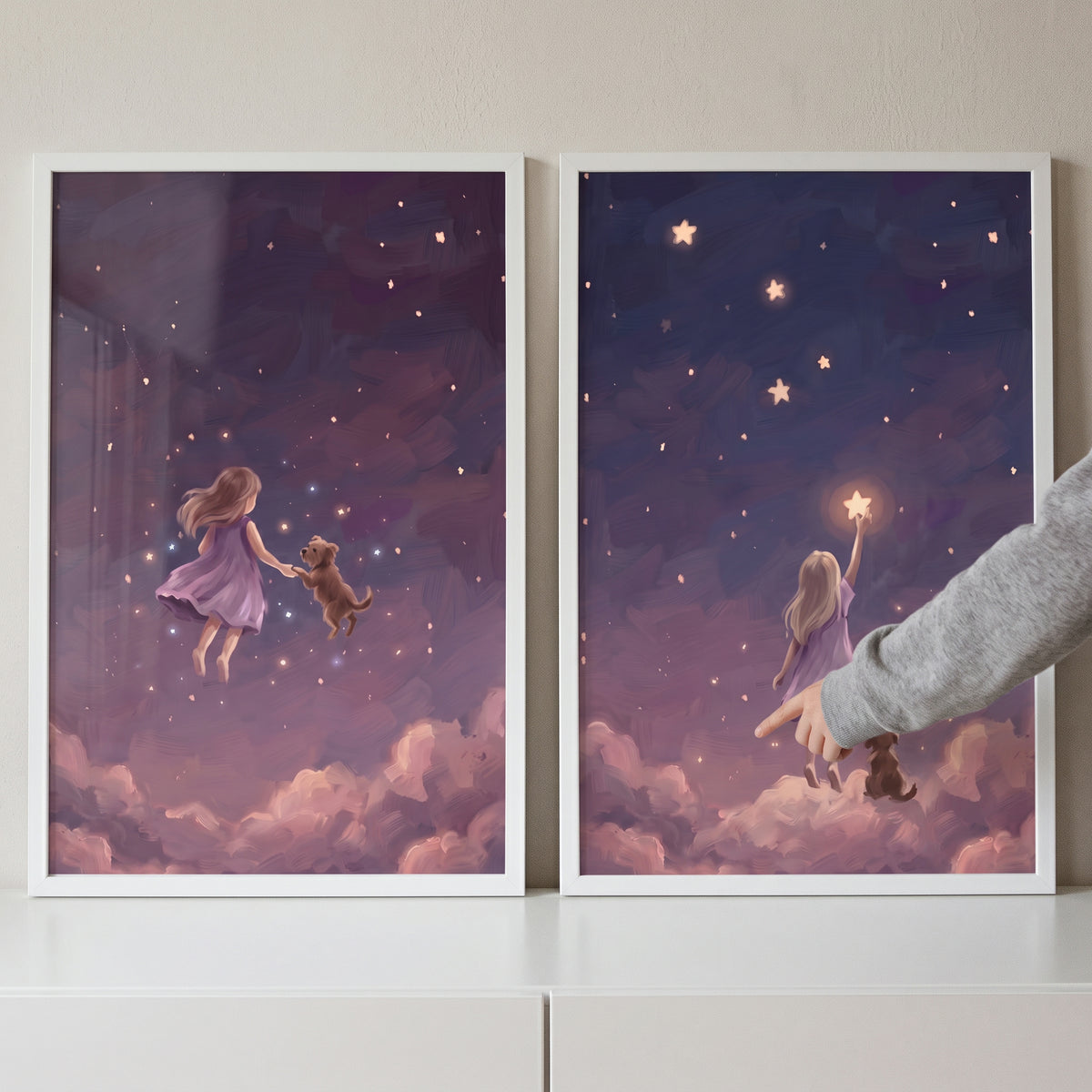 Whimsical starlight girl dog wall art set of 2 shows a girl and dog floating and reaching for a star above pink clouds.