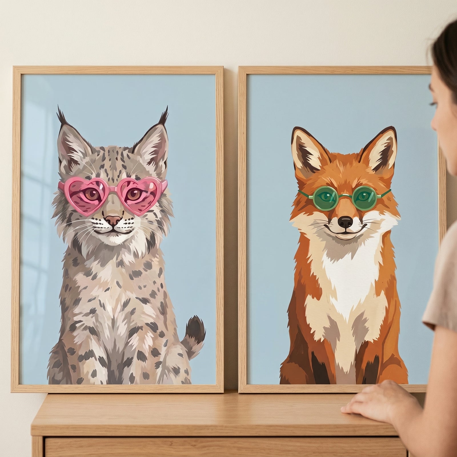 Whimsical sunglass animal wall art set of 2 featuring a lynx in pink heart frames and a fox in green round glasses.