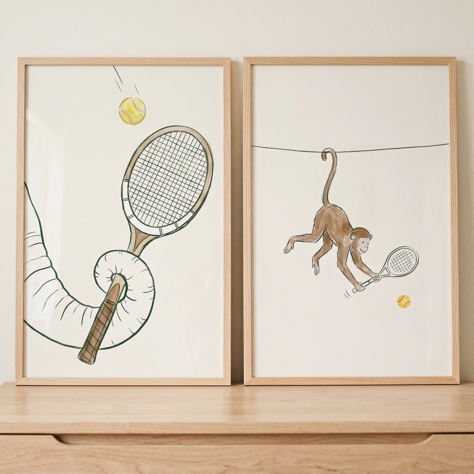 Swinging monkey and elephant trunk hold tennis rackets. Whimsical tennis animal wall art set of 2.