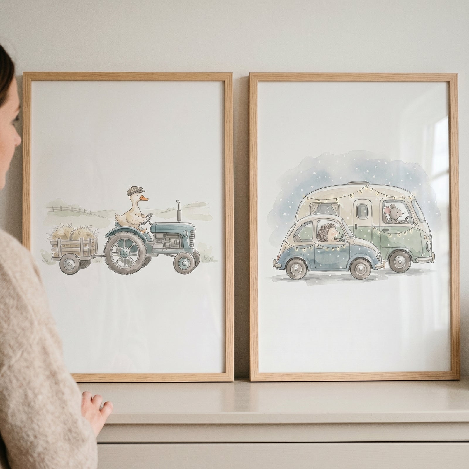 Whimsical watercolor driving animals wall art set of 2 featuring a duck on a tractor and animals in a car and camper.