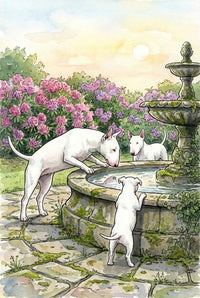 In a quaint stone garden, two adult bull terriers and a puppy gather around an old fountain, peering into the water. Bright blooming rhododendrons and soft sunlight enhance the peaceful charm.
