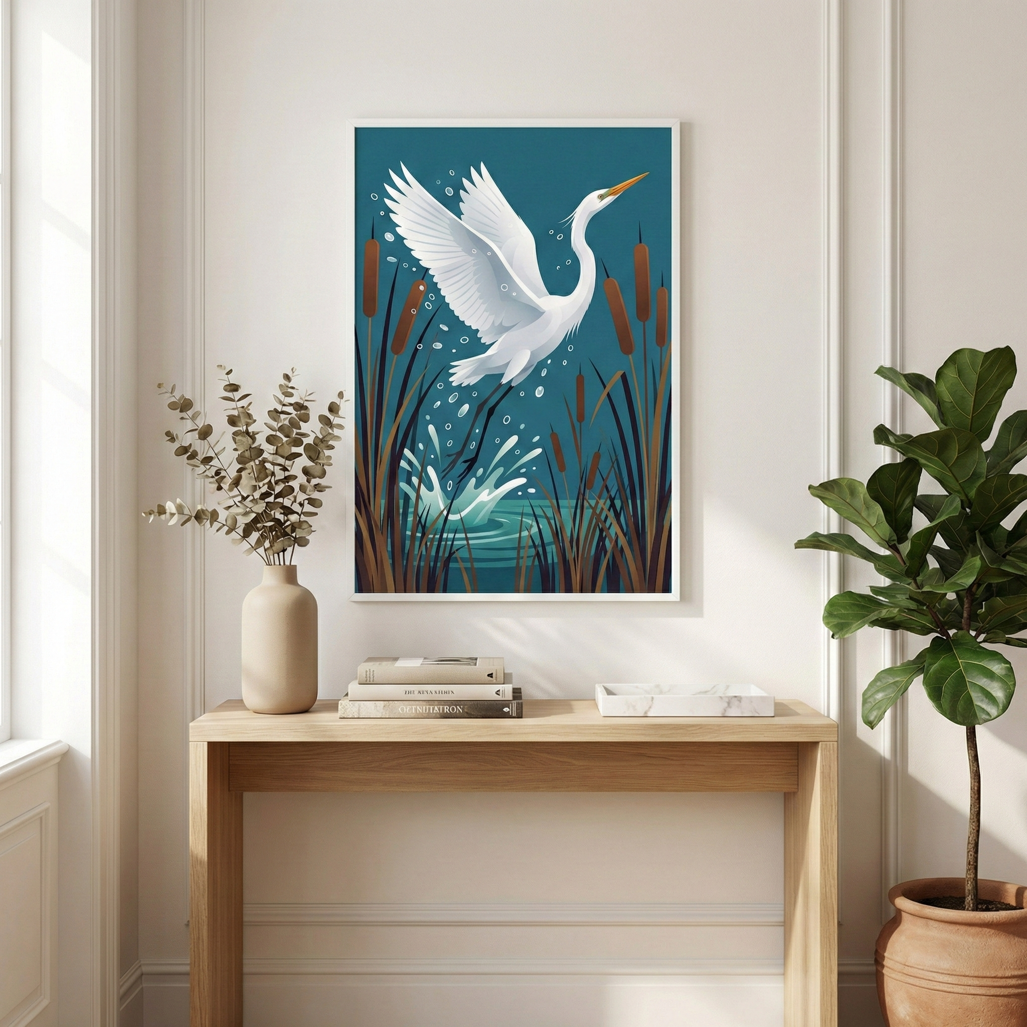 A framed artwork depicts a graceful white heron taking flight from a pond, surrounded by tall cattails and splashing water, set against a rich teal background, and hung above a white fireplace.