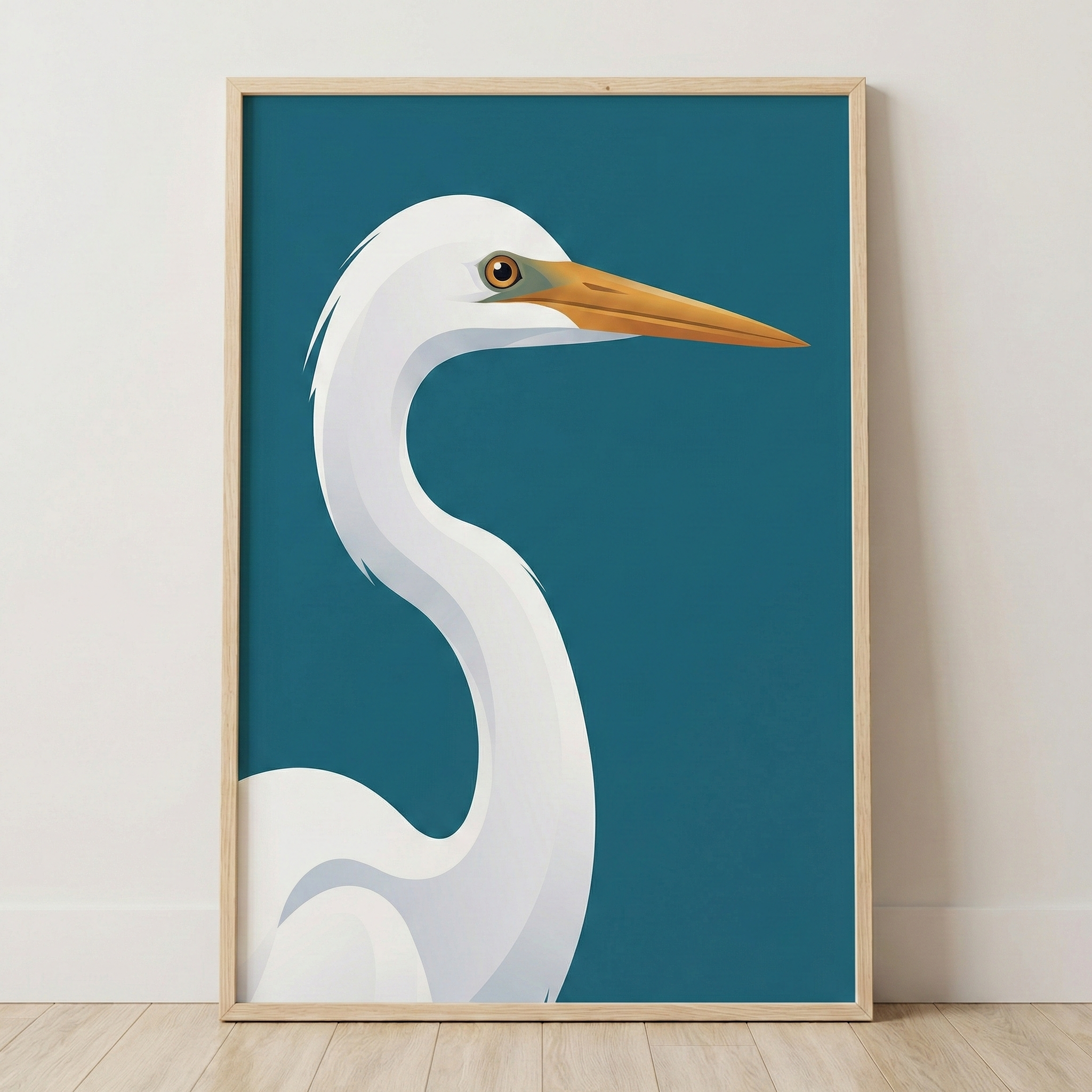 A framed illustration of a white egret with a long orange beak against a teal background, leaning against a white wall on a wooden floor.
