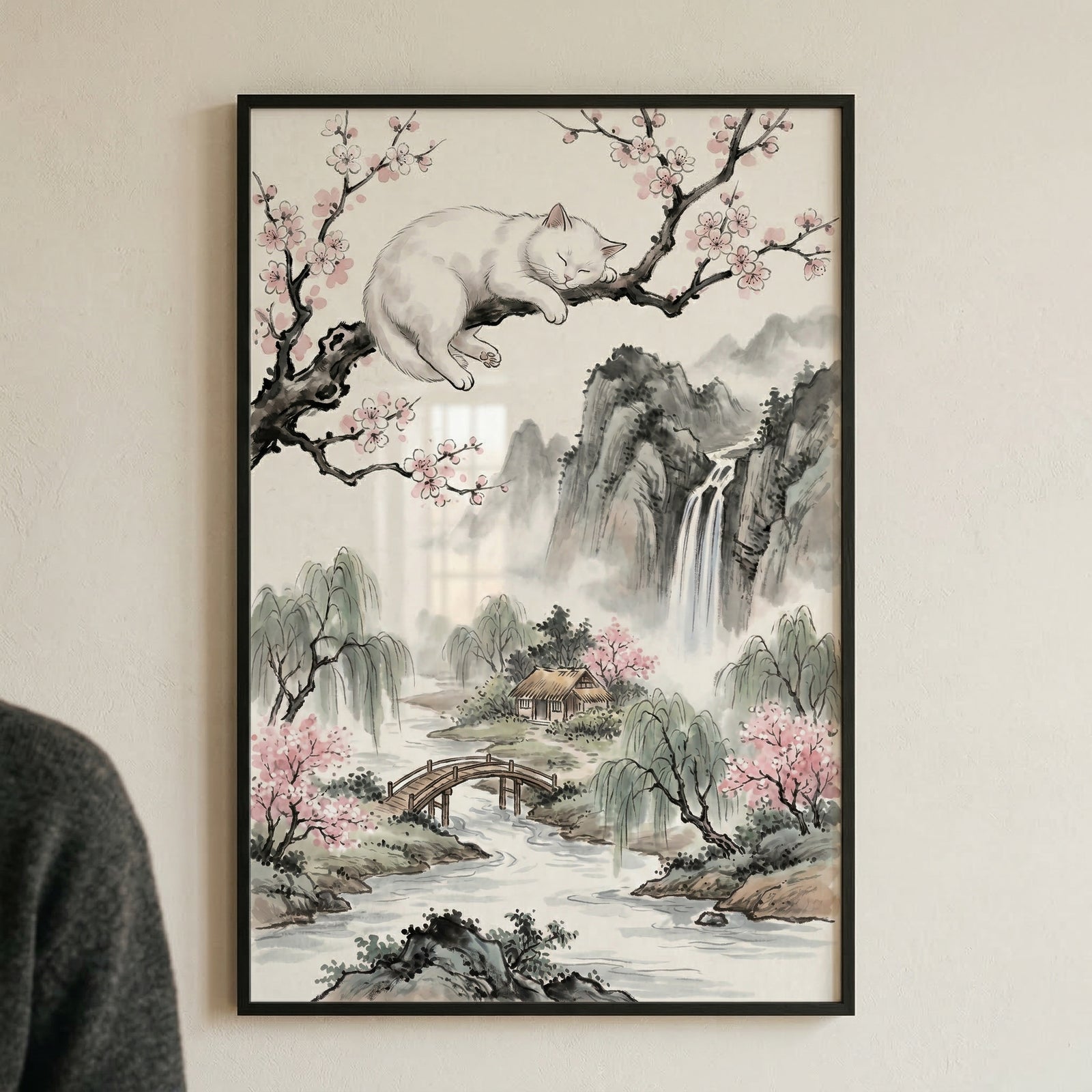 A vertical, framed work of art depicts a serene landscape in a traditional East Asian style. In the upper portion, a plump white cat is curled up asleep on a dark, gnarled branch of a tree adorned with delicate pink blossoms. The background features misty mountains and a tall waterfall cascading down a rocky cliff. In the lower half, a peaceful valley unfolds with a winding river. 