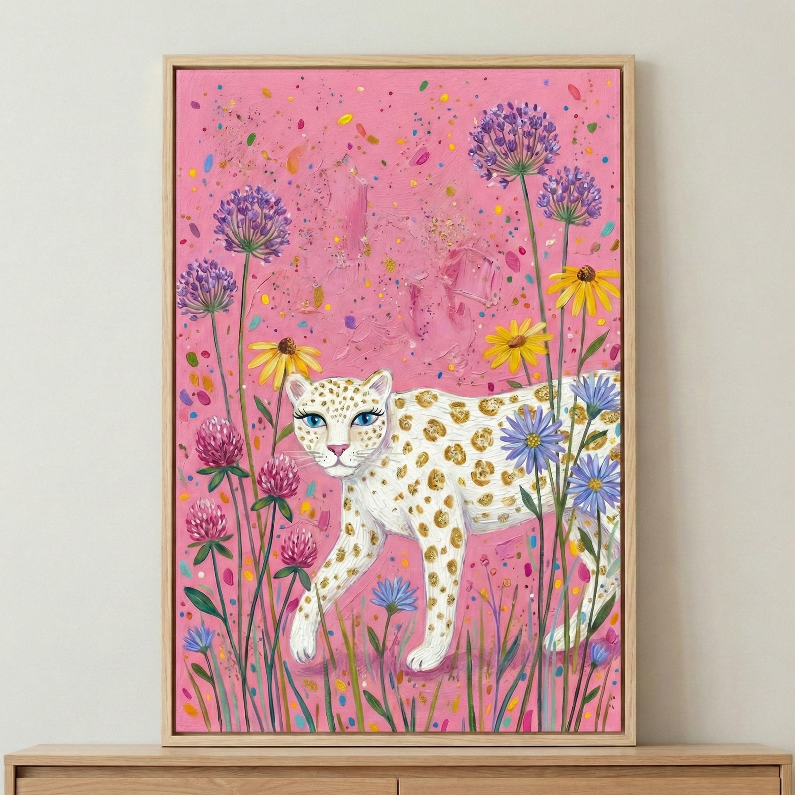 A whimsical artwork depicts a stylized white leopard with golden-brown spots and bright blue eyes walking through a vibrant floral landscape. The leopard is centered and faces toward the left, surrounded by tall, slender-stemmed flowers in shades of purple, yellow, pink, and blue. 
