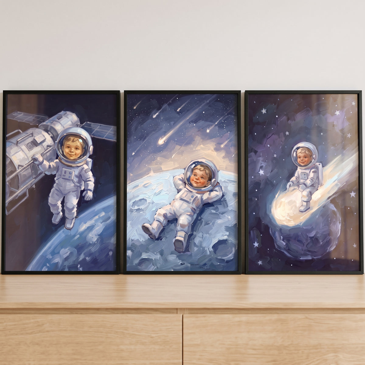 White suit baby astronaut wall art set of 3 shows a child by a satellite, resting on the moon, and riding a comet.