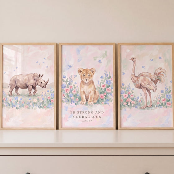 Wildflower pink savanna animals wall art set of 3 with a rhino, lion cub, and ostrich featuring scripture in wood frames.