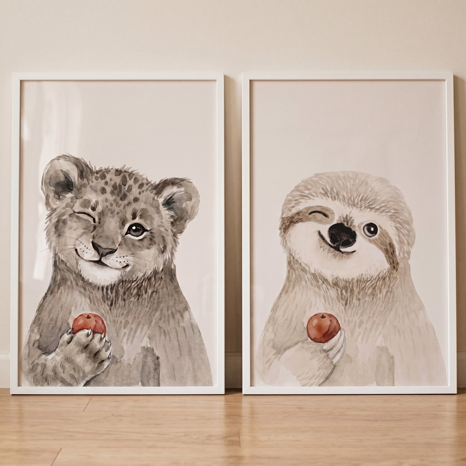 Two framed illustrations of a leopard and a sloth in this winking red fruit animals wall art set of 2.