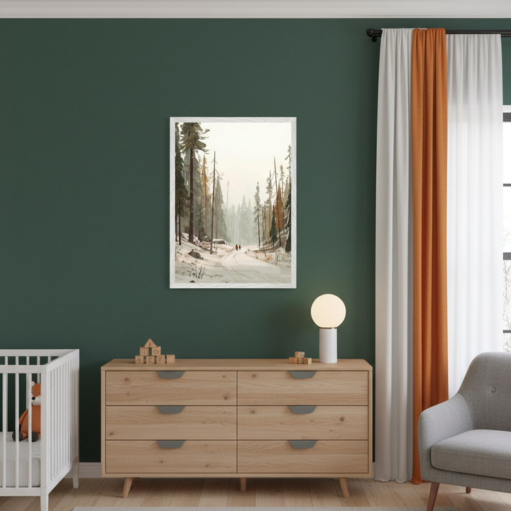 Modern nursery with a dark green wall. A framed illustration of a snowy forest with a road and two distant figures hangs above a light wood dresser. A white crib is left, and a gray armchair is right. Orange drapes are by a window.