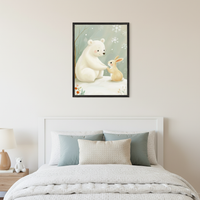 Kid's bedroom with a white bed. A framed watercolor art print of a polar bear and a rabbit in a snowy scene hangs centered above the bed. A nightstand with a lamp and a small white teddy bear is beside the bed.