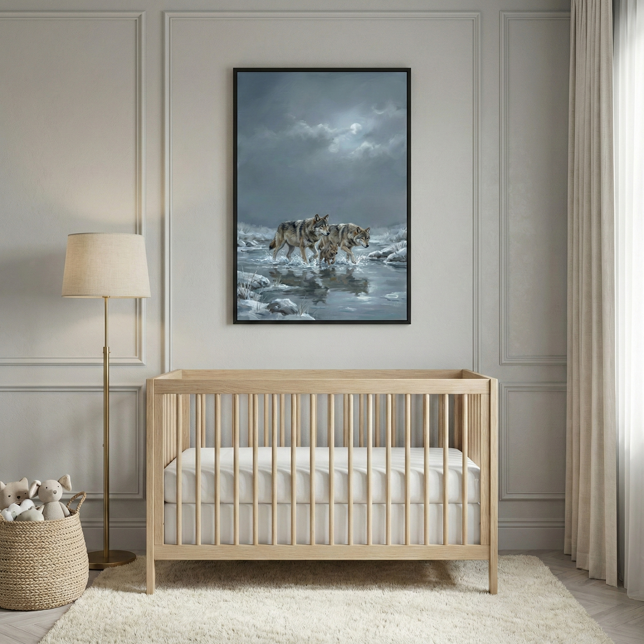 A serene nursery features neutral paneled walls and a plush rug. A light wood crib with a white mattress sits centered. Above it hangs a large, vertically oriented framed illustration depicting two wolves walking through a frozen, icy waterway under a dark, moonlit sky. To the left, a tall brass floor lamp with a beige shade stands near a woven basket filled with stuffed toys. A floor-to-ceiling cream curtain drapes on the right side of the room, adding to the peaceful atmosphere.