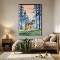 A large framed piece of artwork hangs on a bedroom wall, featuring a watercolor-style illustration of a wolf standing in a forest of blue pine trees under a soft orange sky. Below the wall art, a light wood bed is dressed in tan linens with a dark green textured blanket at the foot. A matching wooden nightstand with a simple lamp sits to the left. On the cream rug are various small wooden toys, creating a peaceful and natural-themed room.