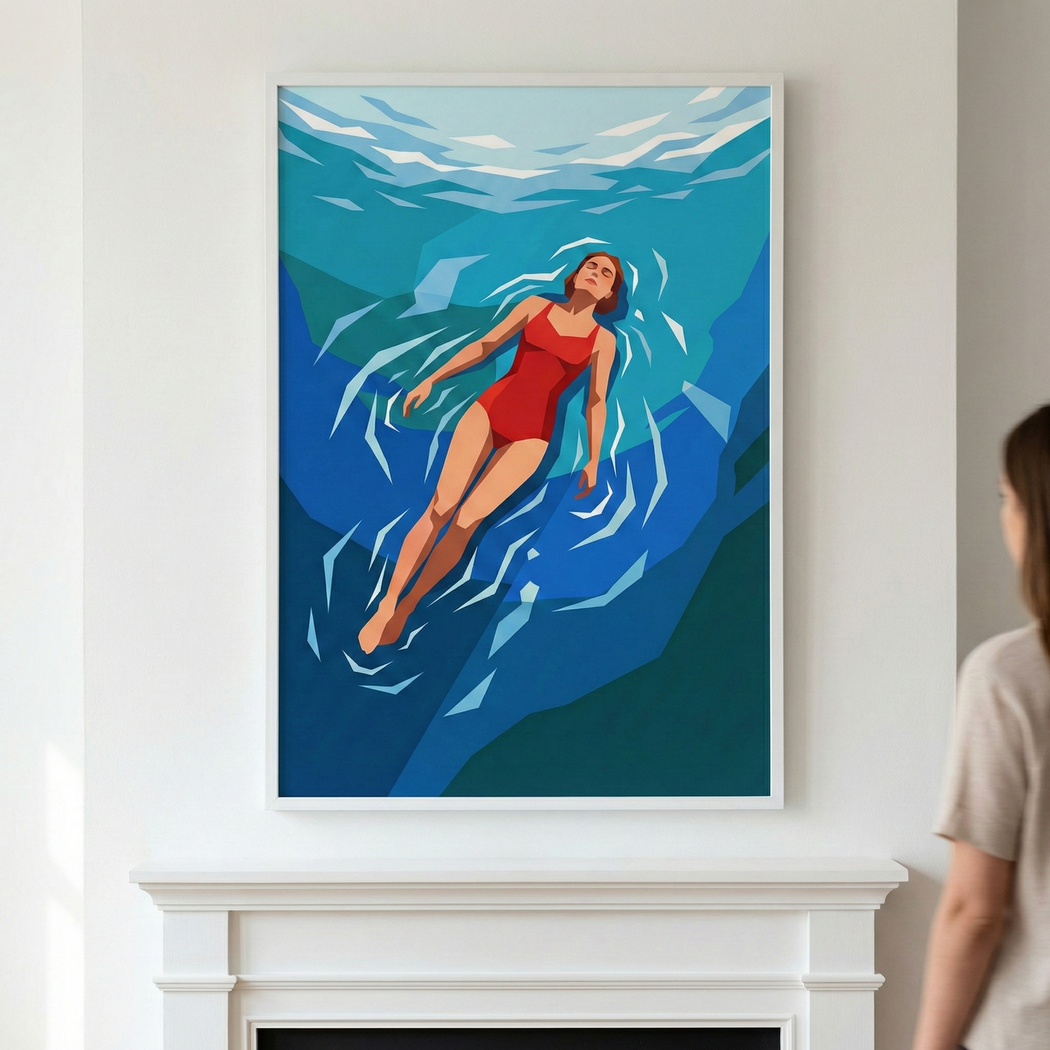 A minimalist digital illustration shows a woman in a vibrant red one-piece swimsuit floating peacefully on her back. The artwork is composed of flat, geometric shapes in various shades of blue, teal, and white, depicting crystalline water and sharp-edged ripples. Captured from an overhead perspective, the scene conveys a sense of serene stillness. The framed piece is displayed on a white wall above a classic white mantelpiece, with a person partially visible on the right side viewing the work.