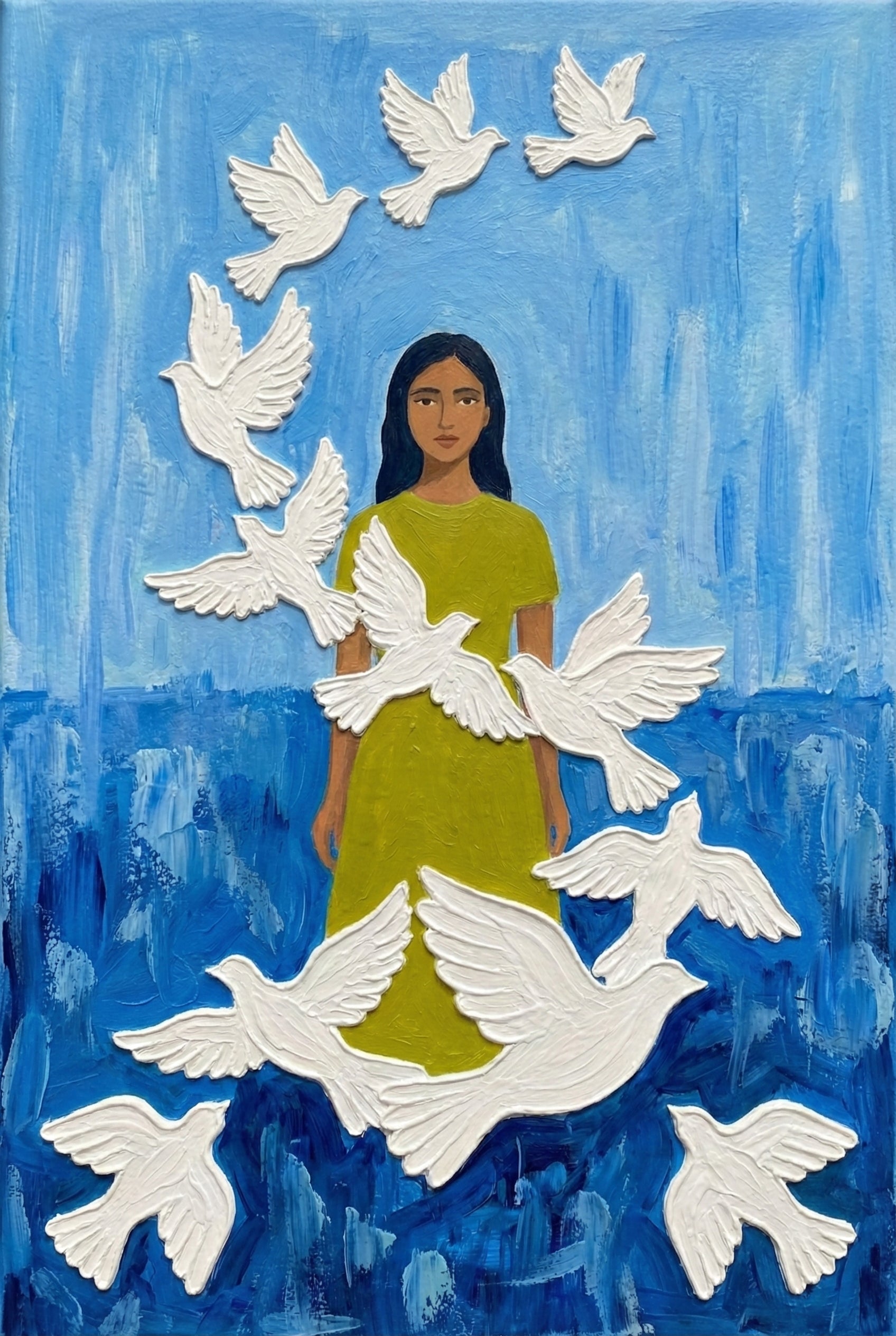 A woman in a green dress stands centered in a vivid blue field as a dozen white doves fly around her in a circular pattern. The background is abstract and sky-like.
