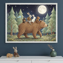 Modern kid's room with a dark blue wall. A large framed children's illustration of a bear carrying a mole, two rabbits, and a bear cub through a forest under a full moon hangs above a white dresser. On the dresser are a wooden bear, rabbit plush, and a green vase.