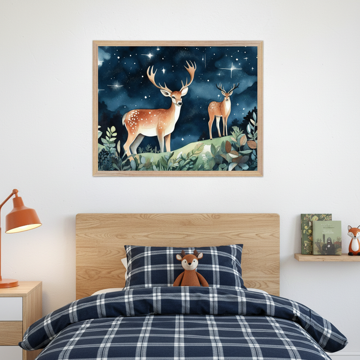 Kid's bedroom with a wooden bed and blue plaid bedding. A large framed watercolor painting of two deer under a starry night sky hangs centered above the bed. An orange lamp is on a nightstand, and books with a fox figurine are on a shelf.