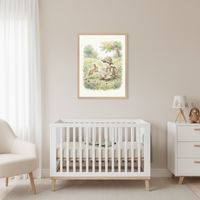 Modern nursery with a white crib, cream armchair, and white dresser. A framed watercolor illustration of a boy in a safari hat sitting in a field with a rabbit hangs on the beige wall above the crib.