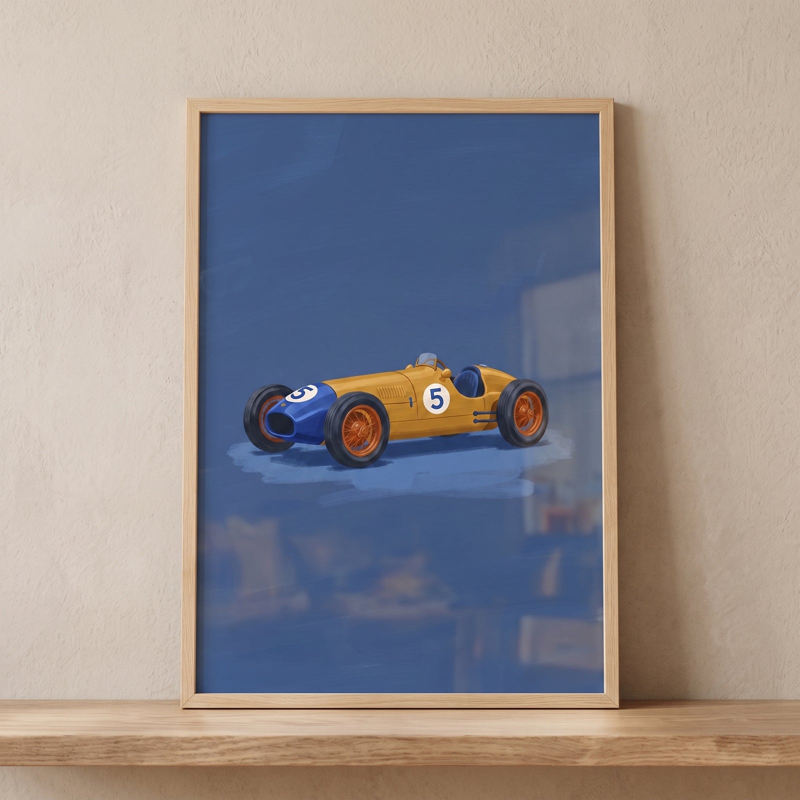 Framed yellow blue vintage car wall art featuring a number five racer on a blue background, displayed on a wooden shelf.